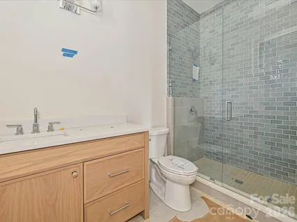 a bathroom with a toilet and a sink