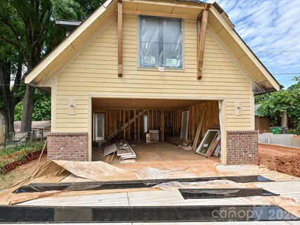 a view of outdoor space with wooden floor and windows