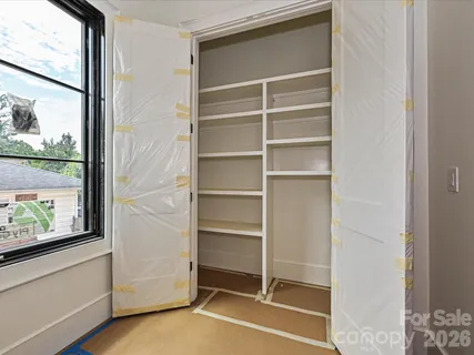 a view of an empty room with a window