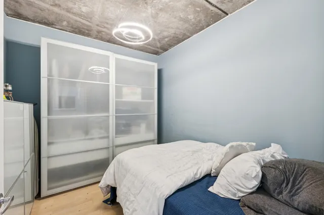 a balcony with furniture and a potted plant