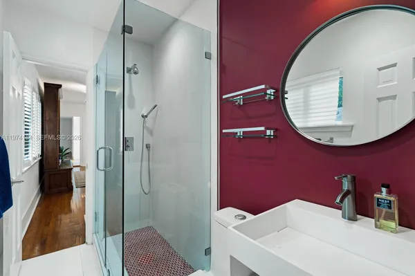 a bathroom with a sink and a mirror