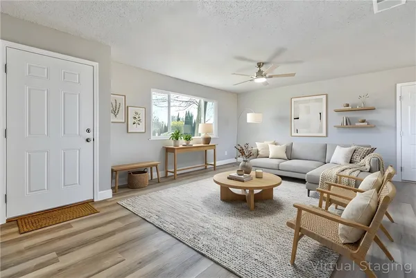 a large kitchen with stainless steel appliances granite countertop a lot of counter space and wooden floors