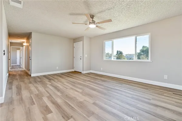 a bathroom with a toilet sink vanity tub and mirror