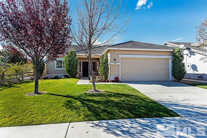 1675 Canyonlands Way Reno, NV 89521 - Photo 1 of 1 a front view of a house with a yard