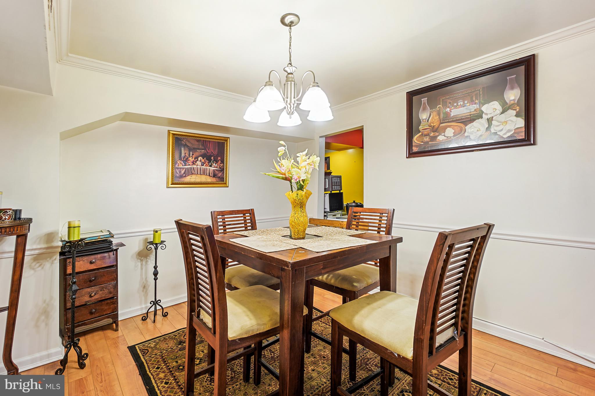 1018 45th Street Northeast Washington, DC 20019 - Photo 11 of 30 a view of a dining room with furniture wooden floor and a chandelier