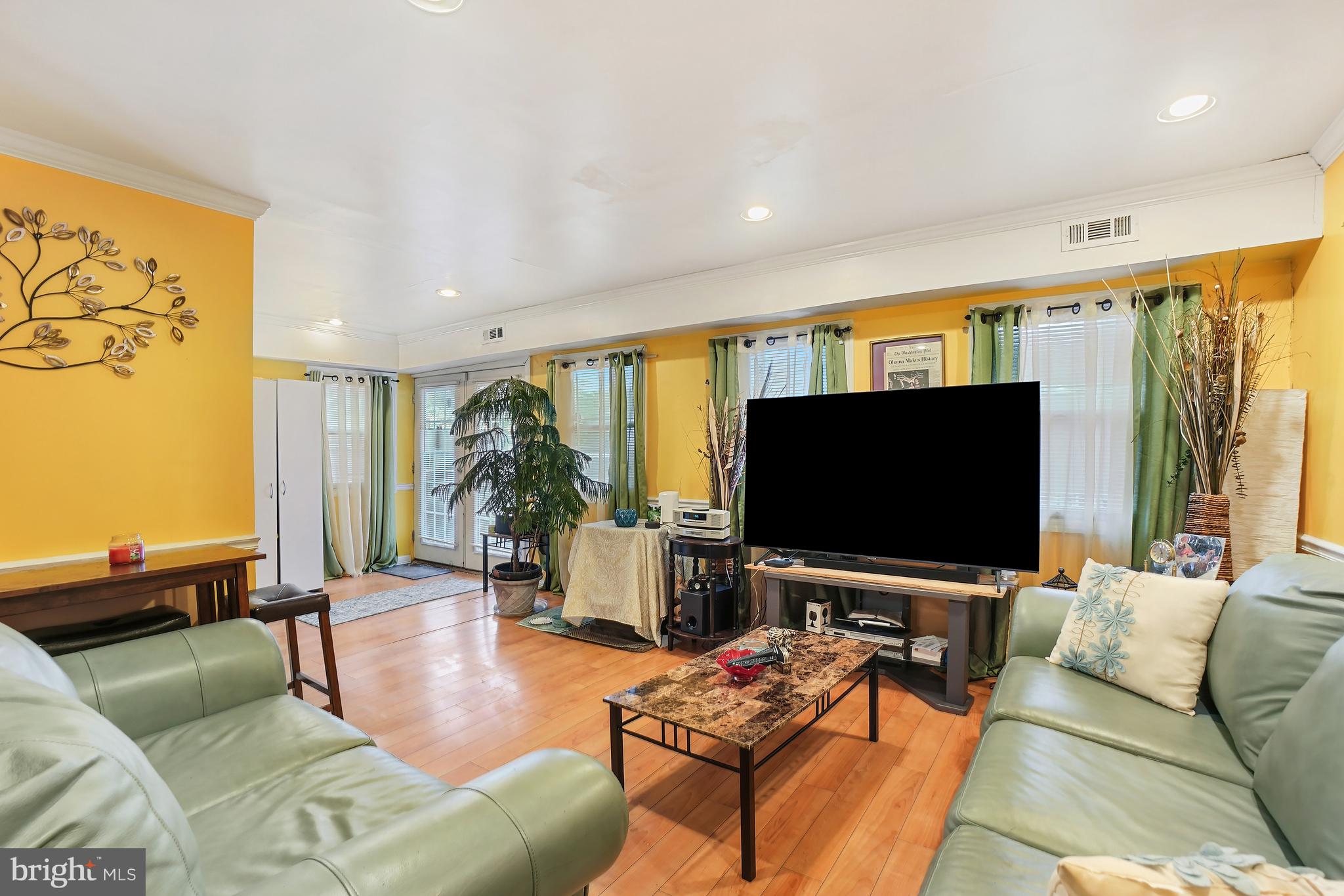 1018 45th Street Northeast Washington, DC 20019 - Photo 14 of 30 a living room with furniture and a flat screen tv