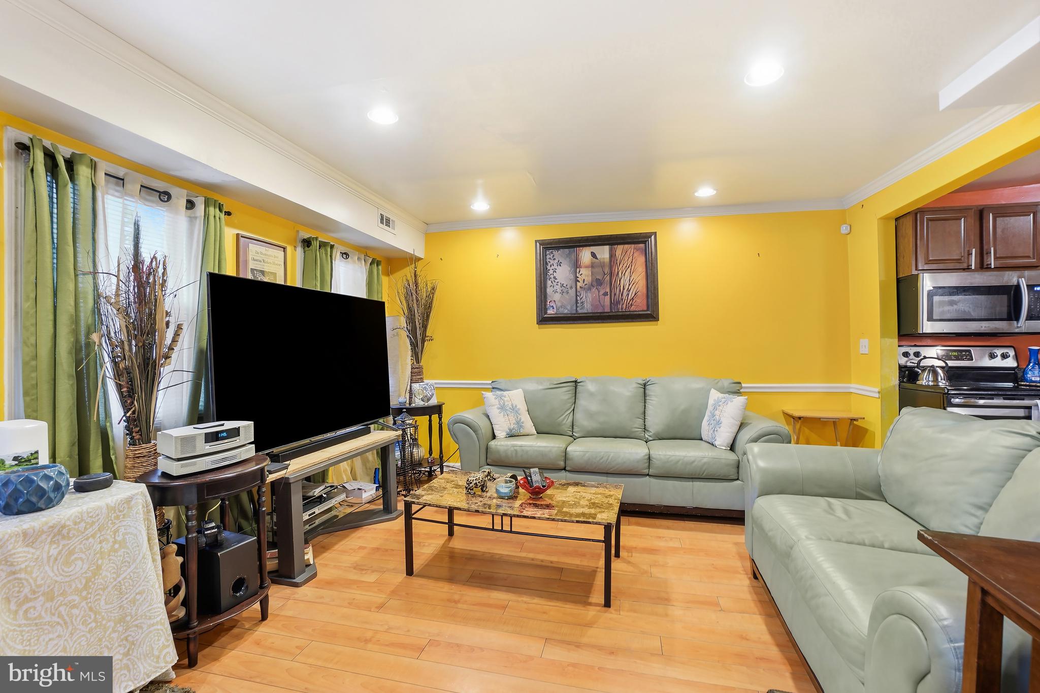 1018 45th Street Northeast Washington, DC 20019 - Photo 16 of 30 a living room with furniture and a flat screen tv
