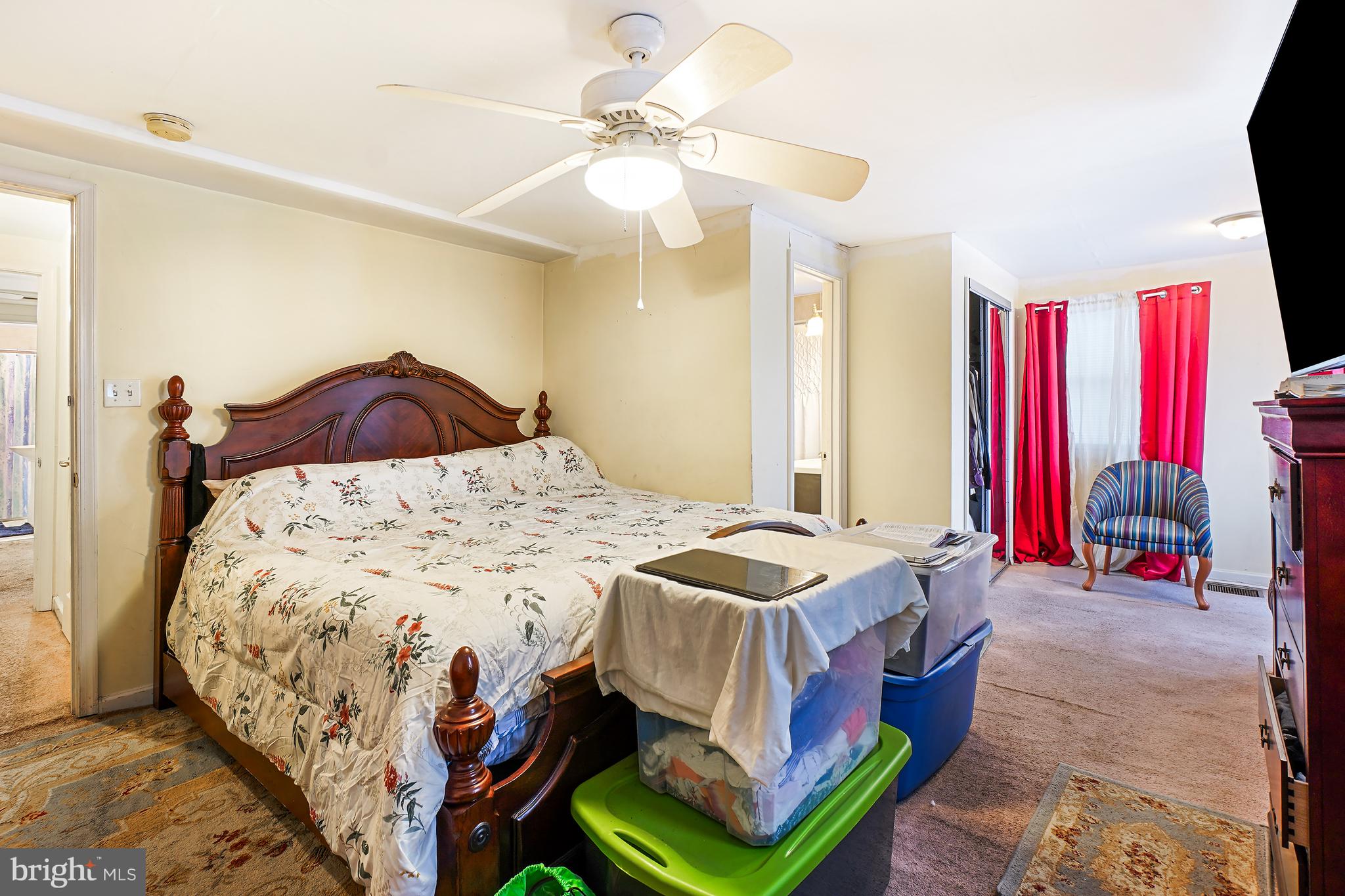 1018 45th Street Northeast Washington, DC 20019 - Photo 20 of 30 a bedroom with a bed and a chandelier