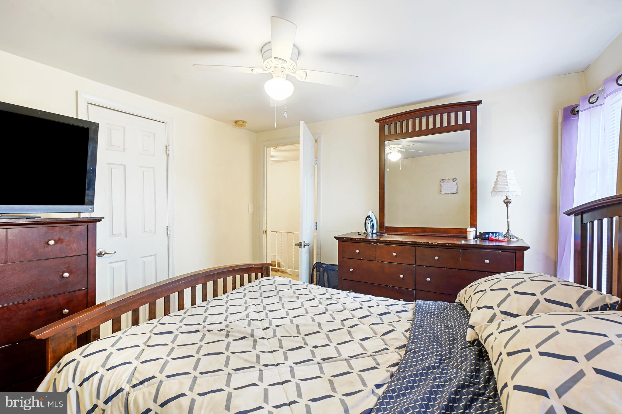 1018 45th Street Northeast Washington, DC 20019 - Photo 25 of 30 a bedroom with a bed and a flat screen tv