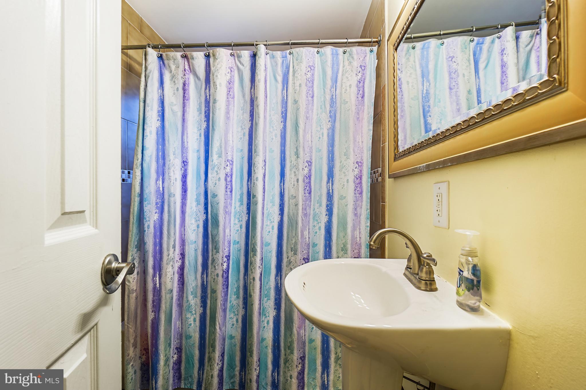 1018 45th Street Northeast Washington, DC 20019 - Photo 26 of 30 a bathroom with a sink and a mirror