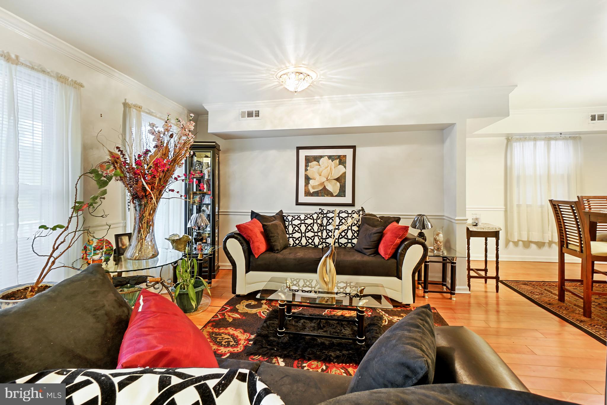 1018 45th Street Northeast Washington, DC 20019 - Photo 6 of 30 a living room with furniture kitchen view and a rug