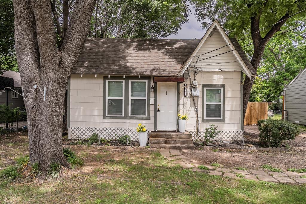 5643 Cary Street Dallas, TX 75227 - Photo 1 of 23 a front view of a house with a yard