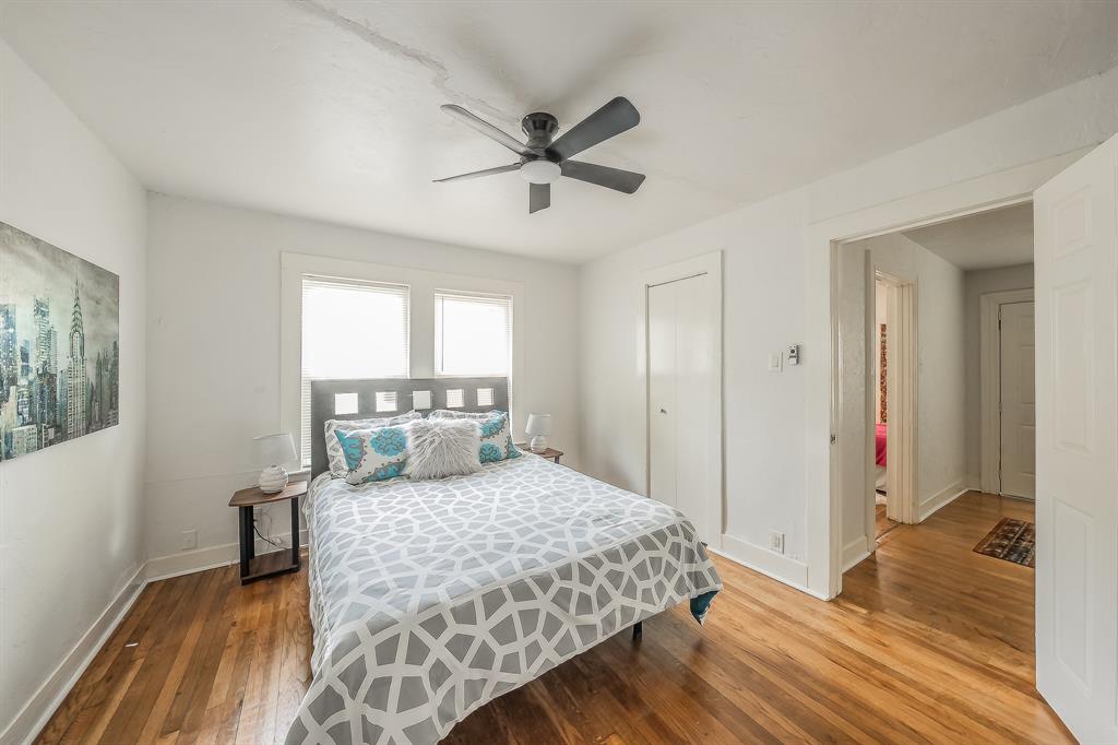 5643 Cary Street Dallas, TX 75227 - Photo 16 of 23 a bedroom with a bed and a window