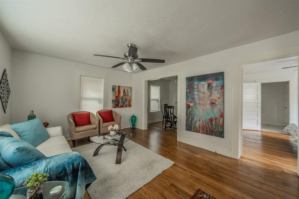 5643 Cary Street Dallas, TX 75227 - Photo 3 of 23 a living room with furniture and wooden floor