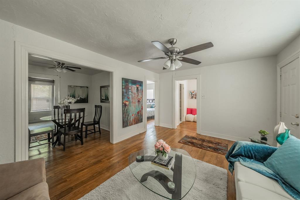 5643 Cary Street Dallas, TX 75227 - Photo 4 of 23 a living room with furniture and wooden floor