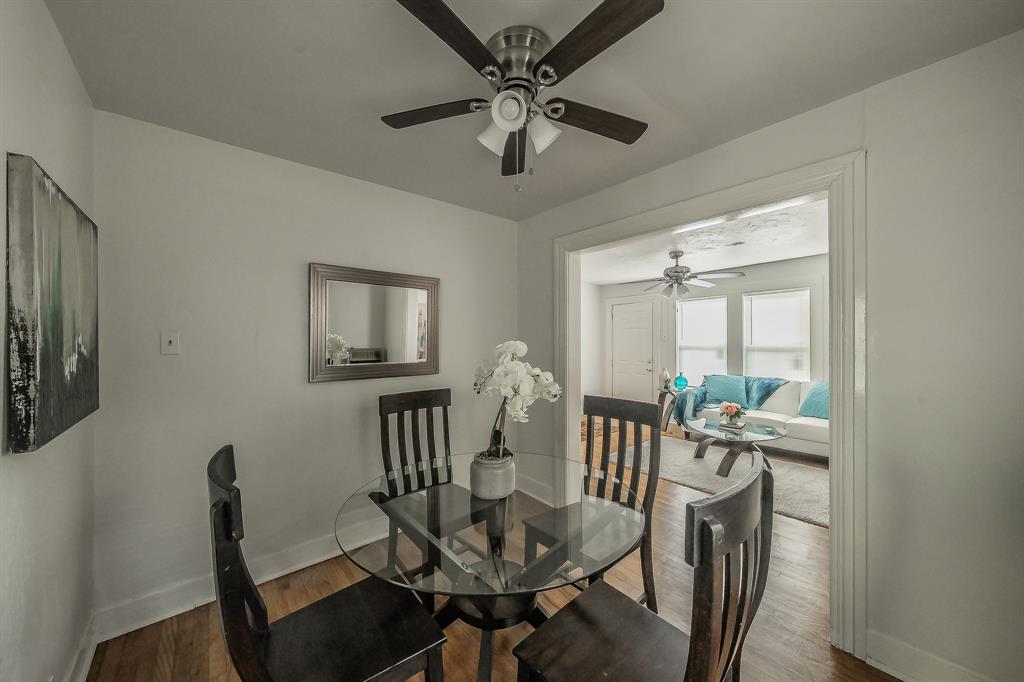 5643 Cary Street Dallas, TX 75227 - Photo 6 of 23 a view of a dining room with furniture window and outside view