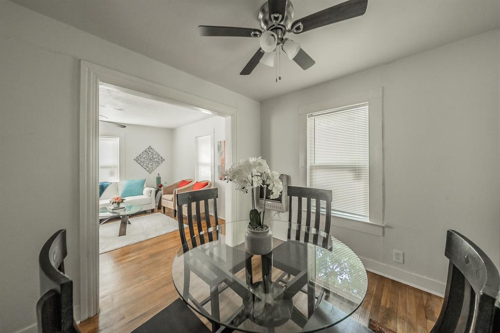 5643 Cary Street Dallas, TX 75227 - Photo 9 of 23 a view of a dining room with furniture window and wooden floor
