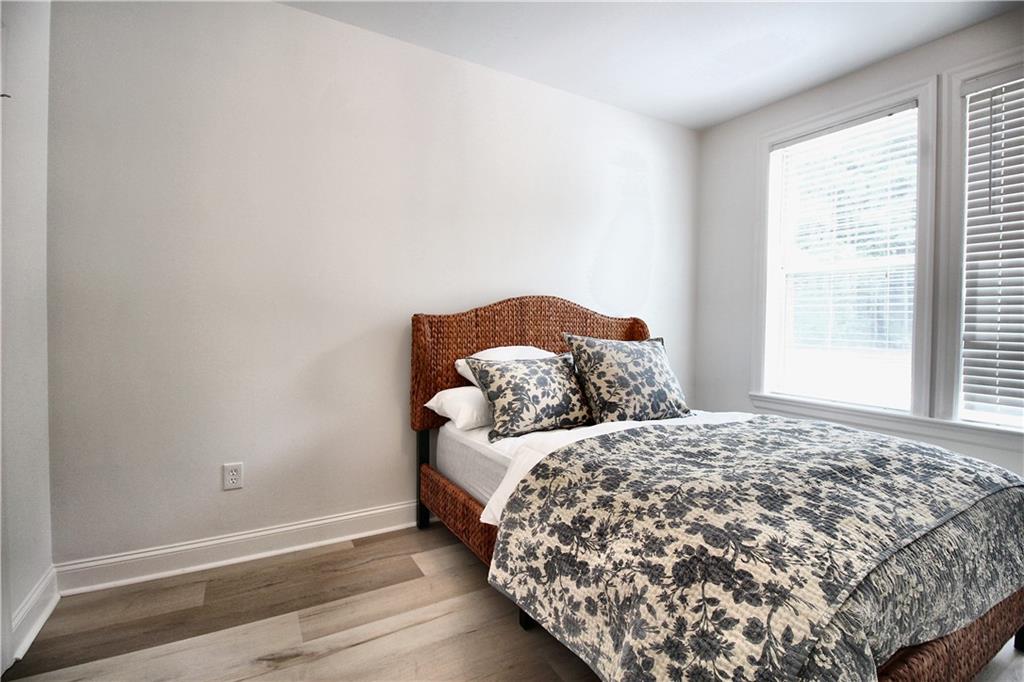 901 Abernathy Road Northeast, Unit 2110 Sandy Springs, GA 30328 - Photo 8 of 29 a bedroom with a bed and a window