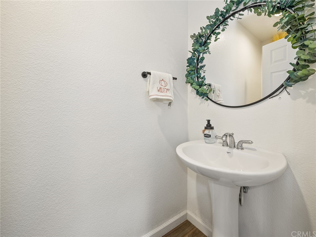 1779 Edmon Way Riverside, CA 92501 - Photo 22 of 63 a bathroom with a sink and a mirror