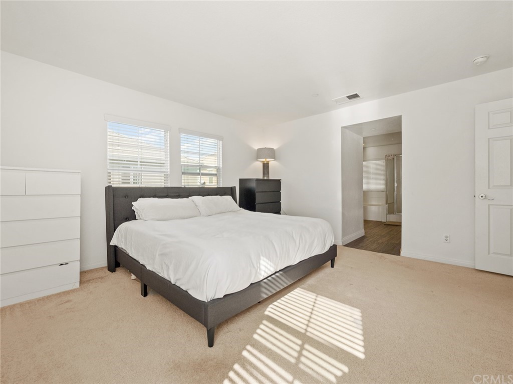 1779 Edmon Way Riverside, CA 92501 - Photo 26 of 63 a bedroom with a bed and window