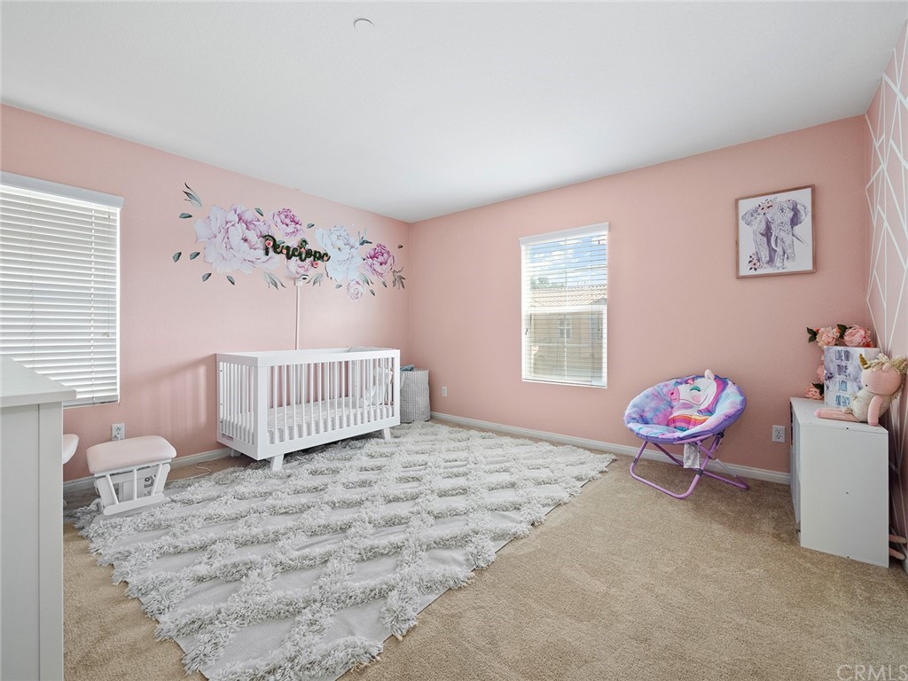 1779 Edmon Way Riverside, CA 92501 - Photo 29 of 63 a bedroom with furniture and window