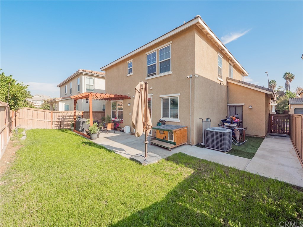 1779 Edmon Way Riverside, CA 92501 - Photo 41 of 63 a view of a house with a backyard patio and swimming pool