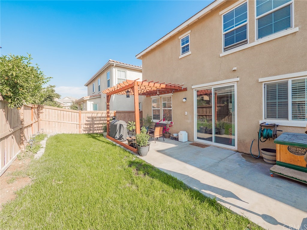 1779 Edmon Way Riverside, CA 92501 - Photo 47 of 63 a view of a house with backyard porch and sitting area