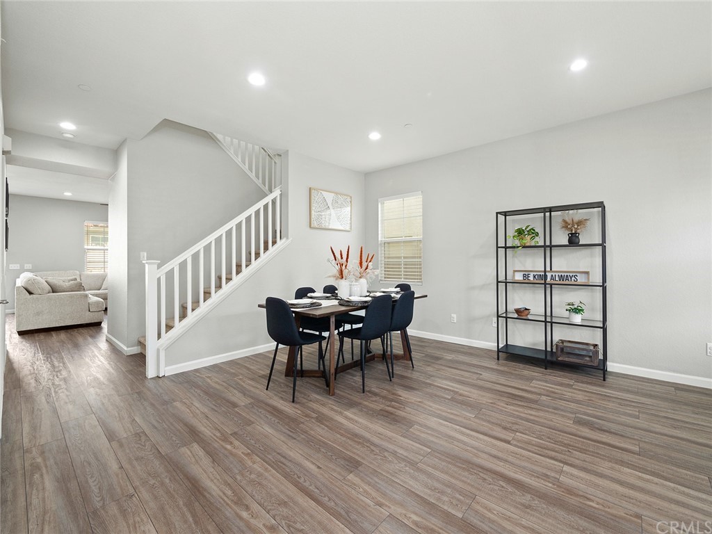 1779 Edmon Way Riverside, CA 92501 - Photo 6 of 63 a view of a livingroom with furniture and wooden floor