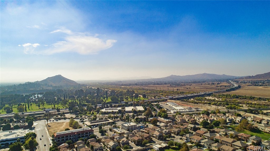 1779 Edmon Way Riverside, CA 92501 - Photo 63 of 63 an aerial view of residential house with parking and mountain view in back