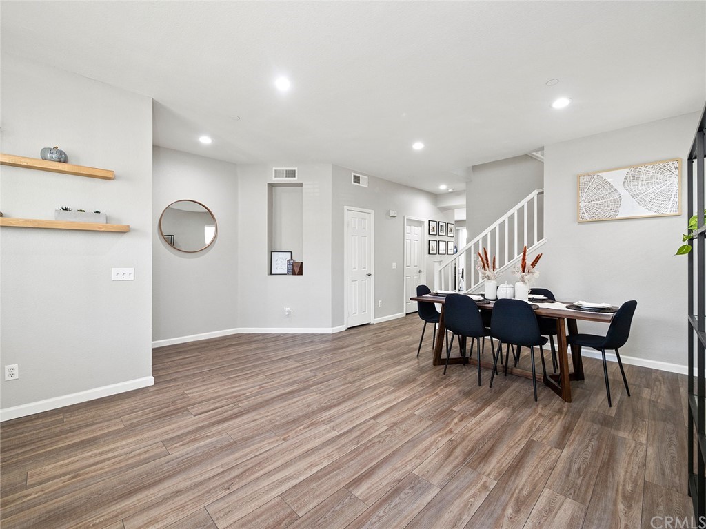 1779 Edmon Way Riverside, CA 92501 - Photo 8 of 63 a view of a dining room with furniture and wooden floor