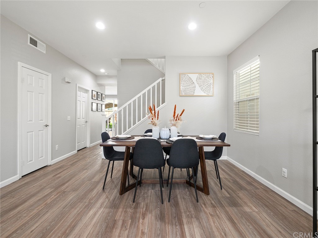 1779 Edmon Way Riverside, CA 92501 - Photo 9 of 63 a view of a dining room with furniture and wooden floor