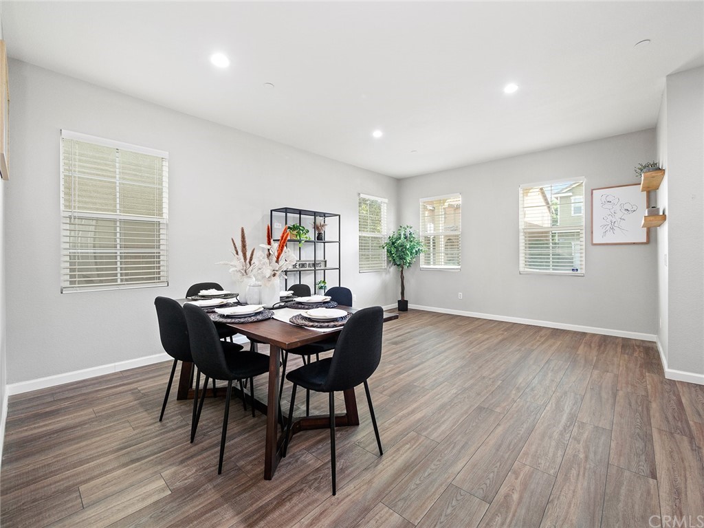 1779 Edmon Way Riverside, CA 92501 - Photo 10 of 63 a view of a dining room with furniture window and wooden floor