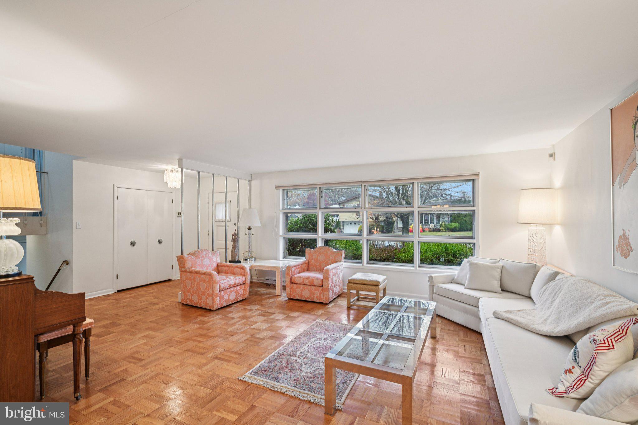 9227 Burbank Road Philadelphia, PA 19115 - Photo 11 of 46 a living room with furniture and a large window