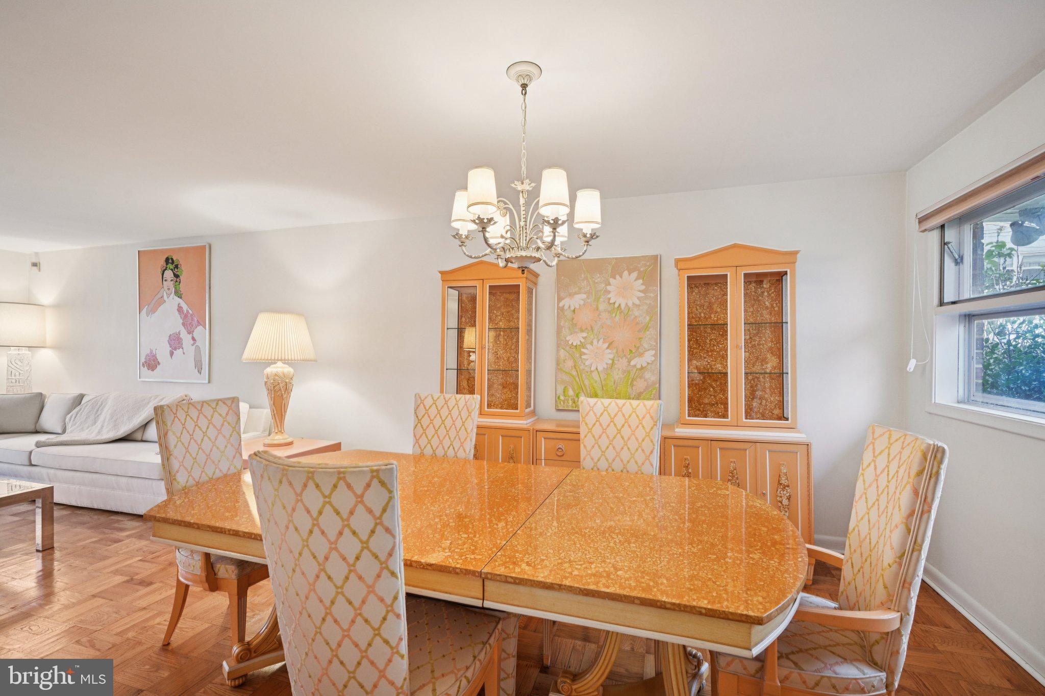 9227 Burbank Road Philadelphia, PA 19115 - Photo 15 of 46 a view of a dining room with furniture wooden floor and chandelier