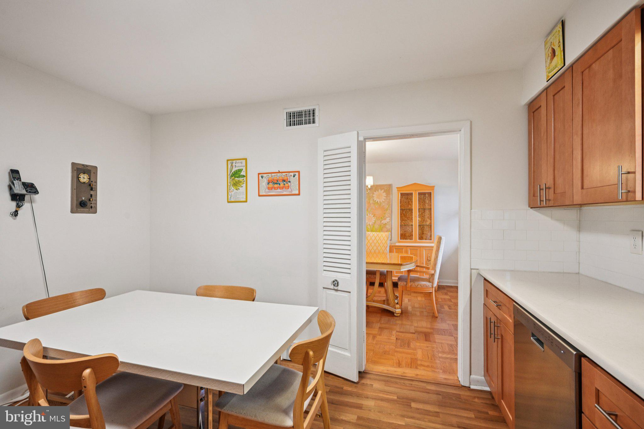 9227 Burbank Road Philadelphia, PA 19115 - Photo 16 of 46 a view of a dining room with furniture and wooden floor