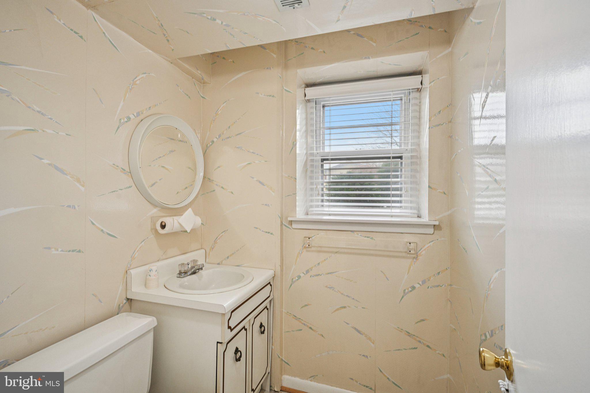 9227 Burbank Road Philadelphia, PA 19115 - Photo 32 of 46 a bathroom with a sink and a mirror