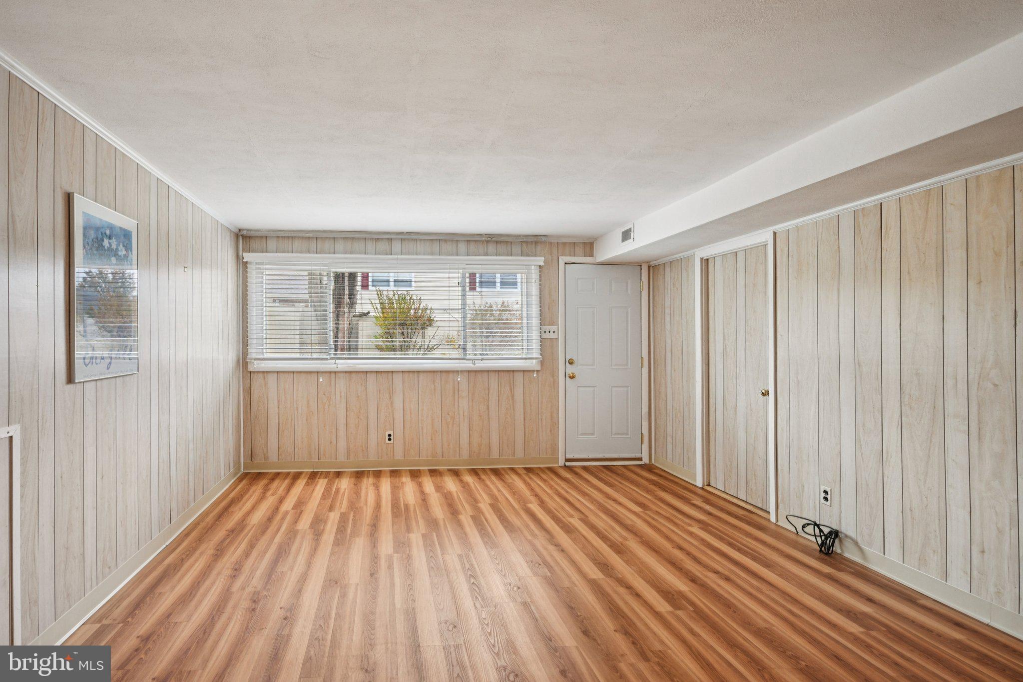 9227 Burbank Road Philadelphia, PA 19115 - Photo 33 of 46 a view of a room with wooden floor and windows