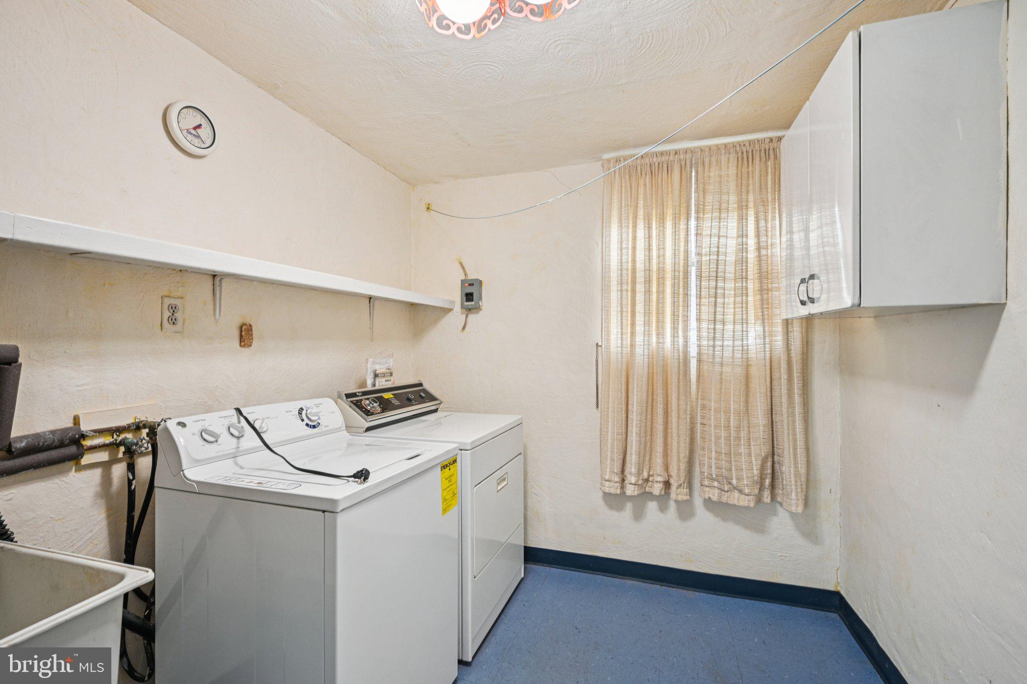 9227 Burbank Road Philadelphia, PA 19115 - Photo 35 of 46 a utility room with dryer and washer
