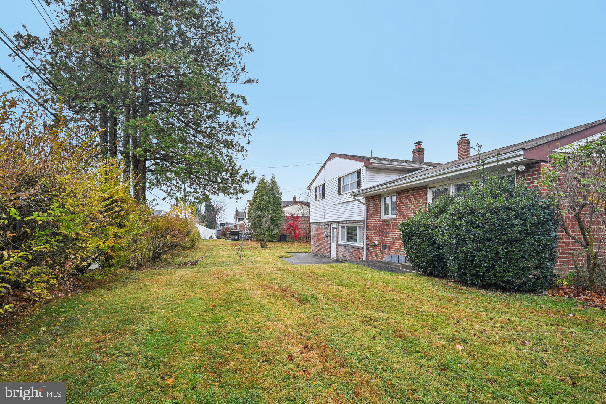 9227 Burbank Road Philadelphia, PA 19115 - Photo 37 of 46 a view of a house with a big yard and large tree