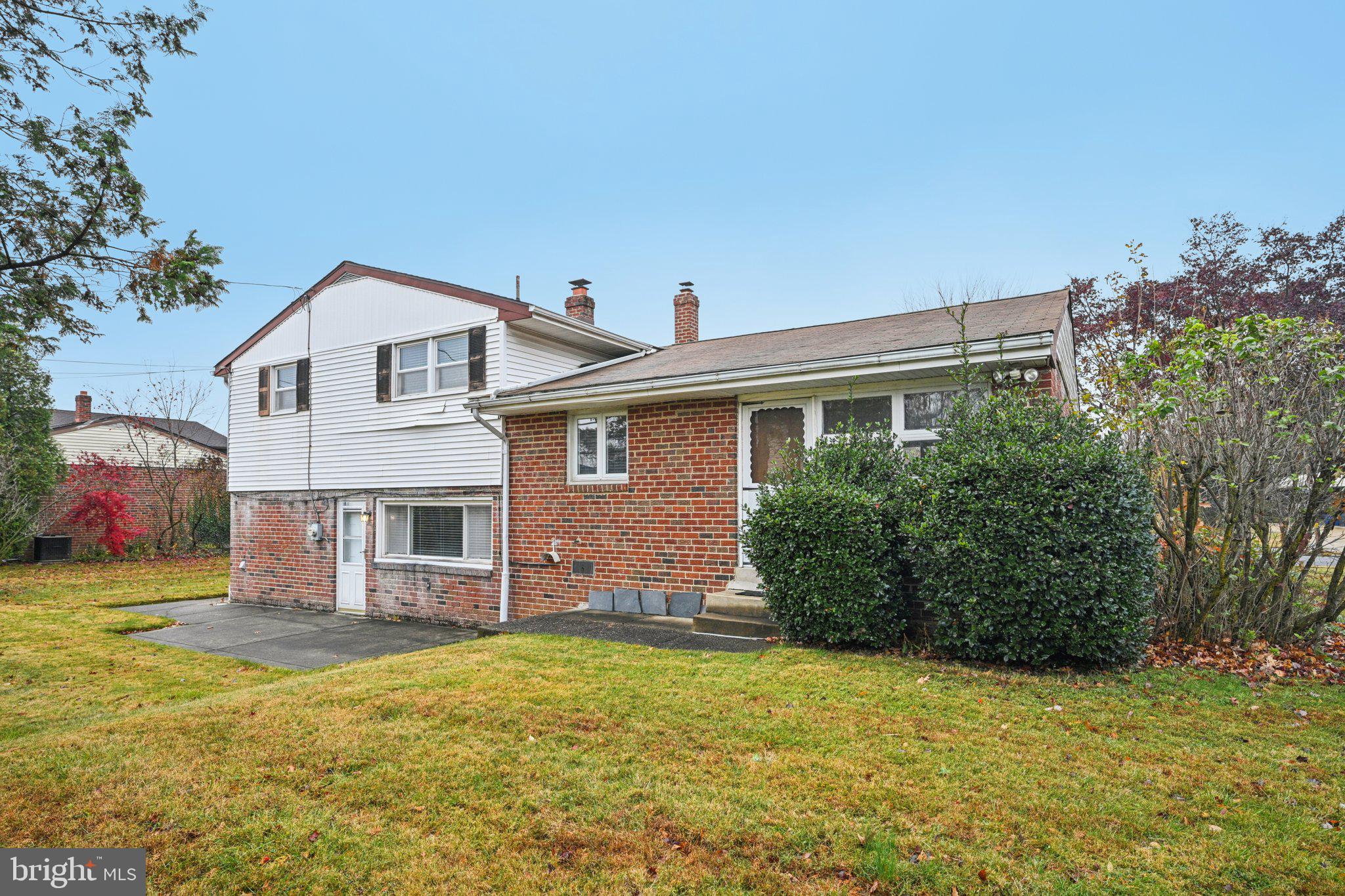 9227 Burbank Road Philadelphia, PA 19115 - Photo 38 of 46 a front view of a house with garden