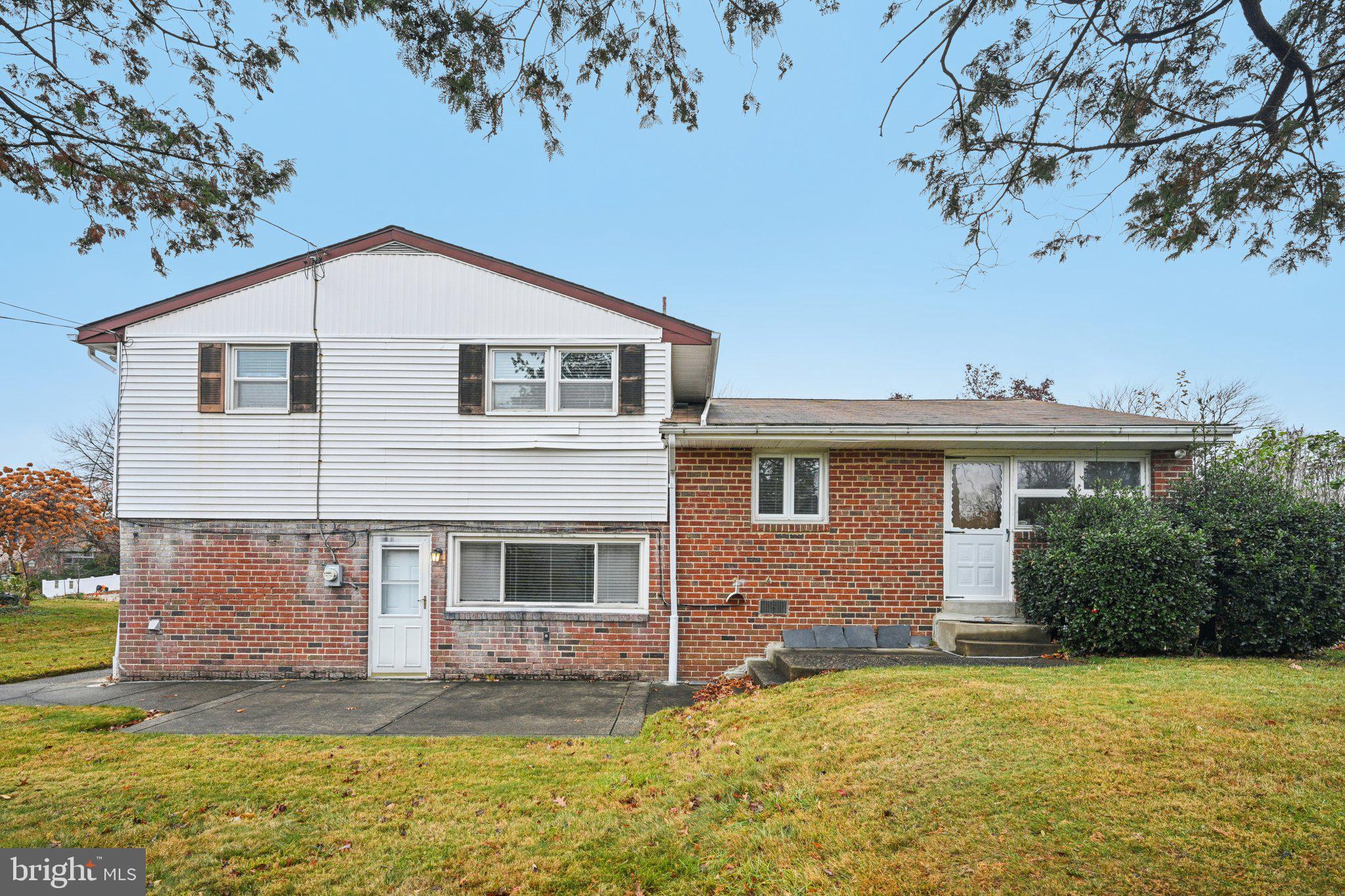 9227 Burbank Road Philadelphia, PA 19115 - Photo 39 of 46 a front view of a house with a yard