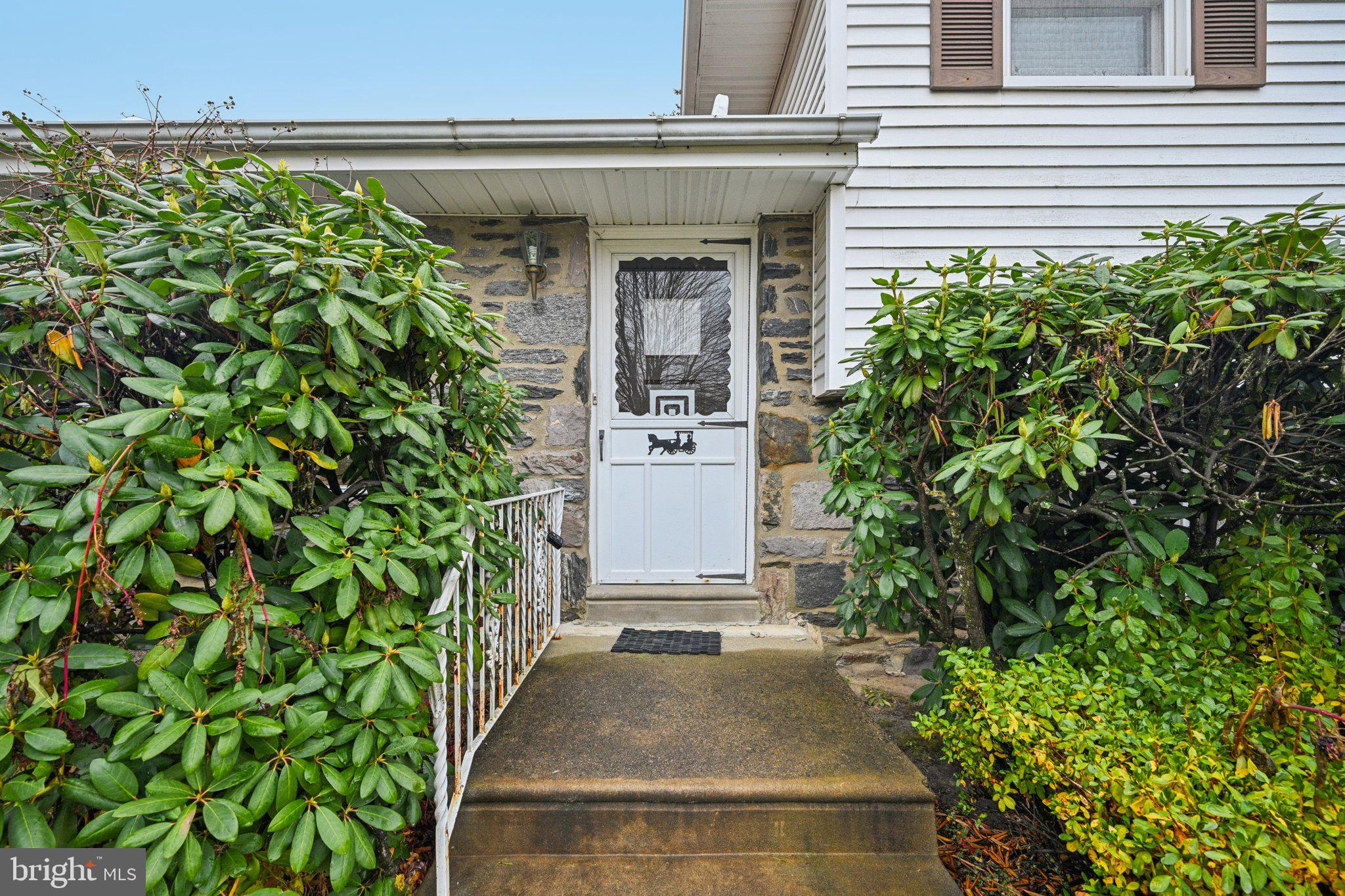 9227 Burbank Road Philadelphia, PA 19115 - Photo 4 of 46 an entrance to house with yard and green space