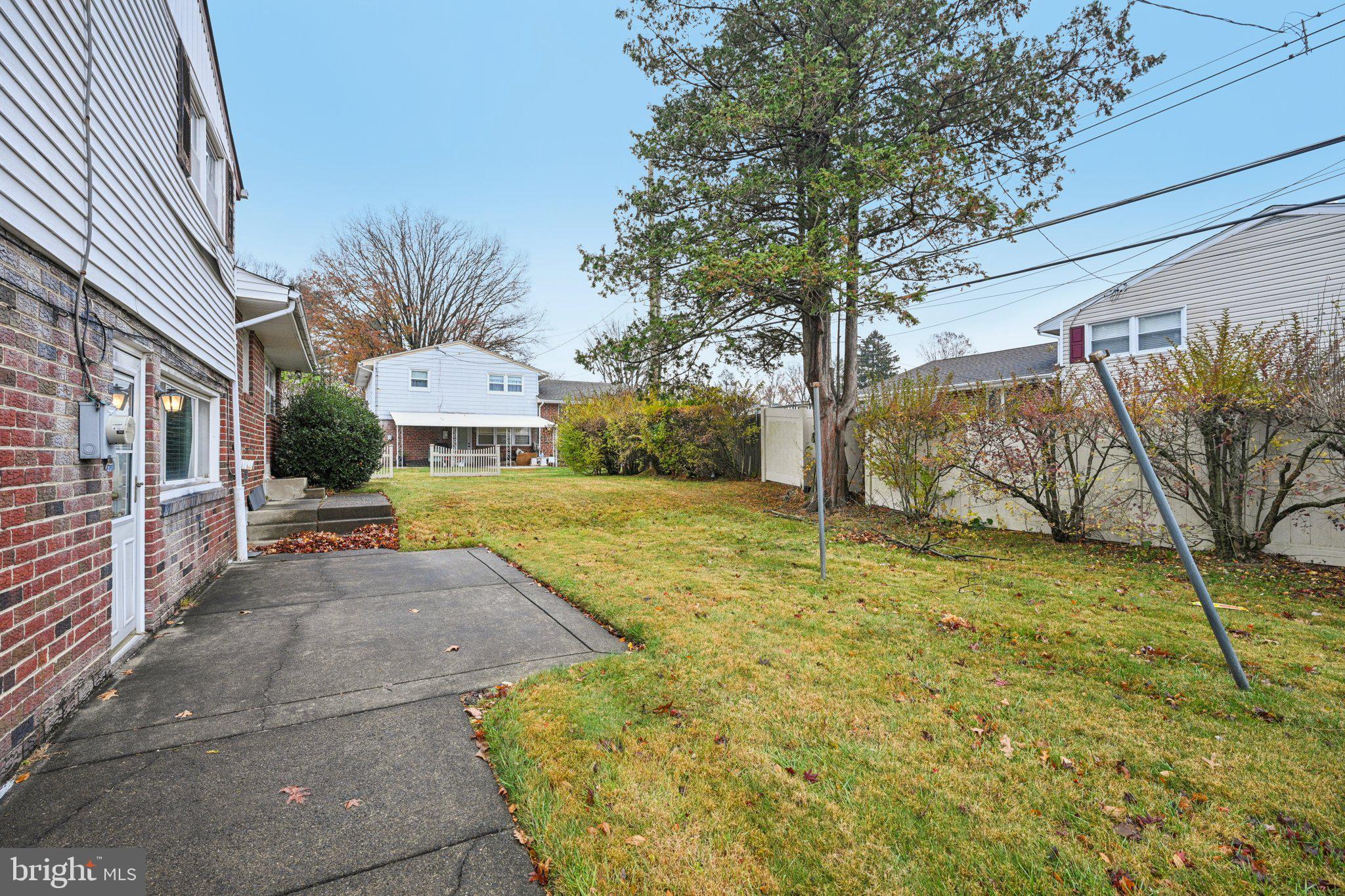 9227 Burbank Road Philadelphia, PA 19115 - Photo 41 of 46 a view of a yard with plants and trees