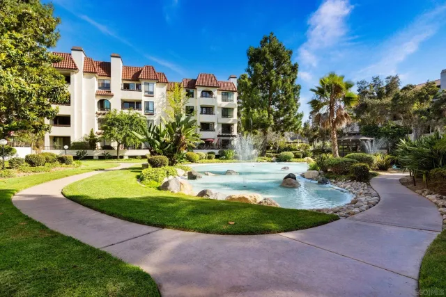 a view of a swimming pool with a house