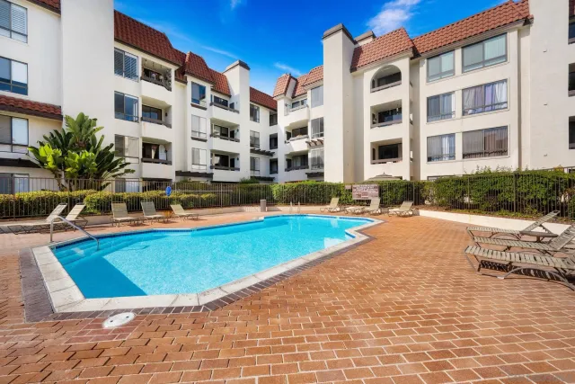 a view of a building with swimming pool