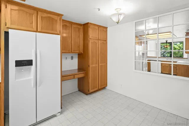 a kitchen with stainless steel appliances a refrigerator and a stove
