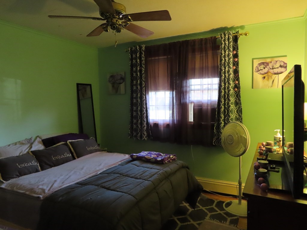 166 Upper County Road, Unit 12 Dennis, MA 02639 - Photo 6 of 9 a bedroom with a bed and a window