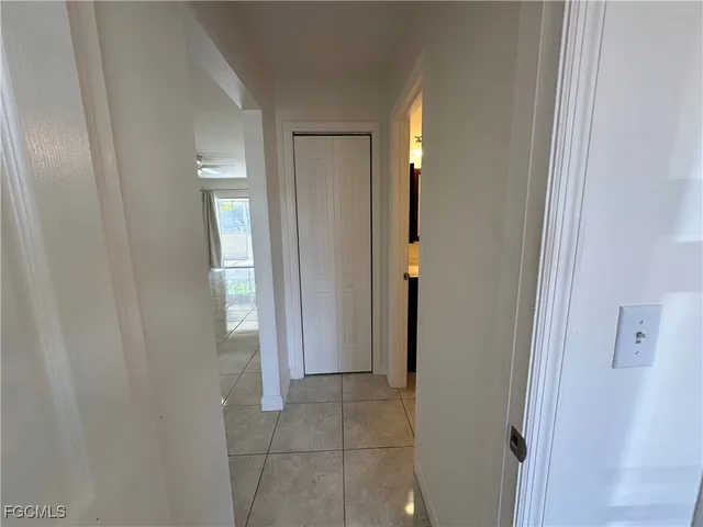 a view of a bathroom with a sink and a mirror