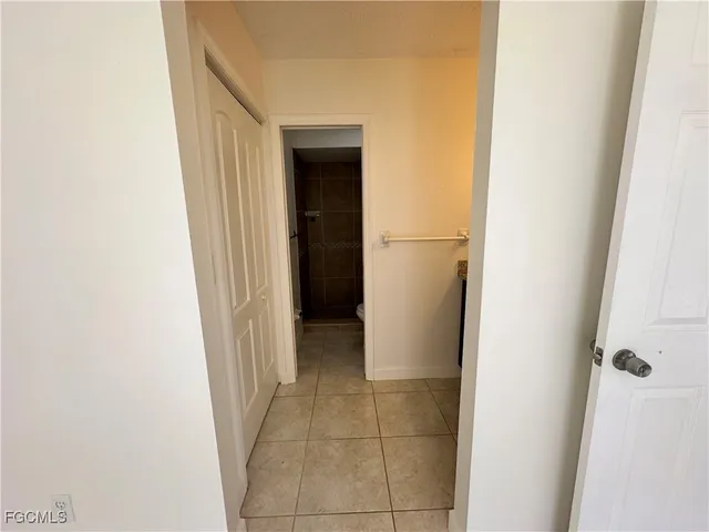 a view of a hallway and closet