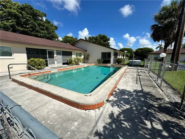 a view of a house with backyard porch and sitting area